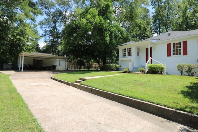 ranch-style home with a carport and a front yard