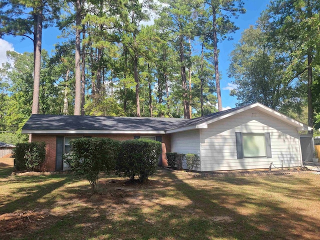 view of side of home featuring a yard