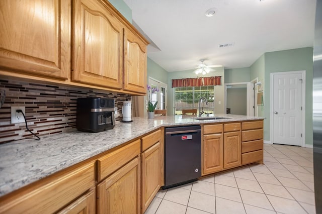 112 Lewellin Pl, Lufkin, TX 75904 - kitchen featuring black dishwasher, a sink, decorative backsplash, light tile patterned floors, and a peninsula