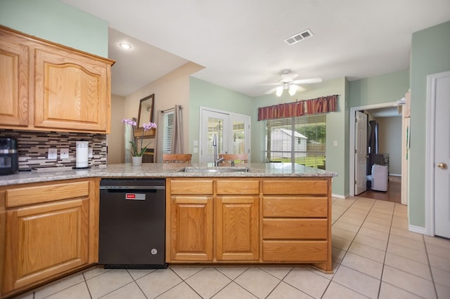 112 Lewellin Pl, Lufkin, TX 75904 - kitchen featuring dishwashing machine, a sink, tasteful backsplash, and light tile patterned floors