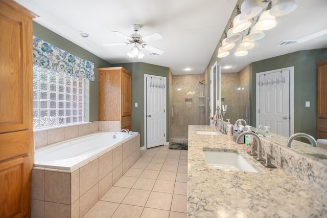 112 Lewellin Pl, Lufkin, TX 75904 - bathroom featuring a shower stall, a garden tub, double vanity, tile patterned floors, and a ceiling fan