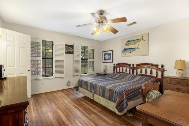 bedroom with hardwood / wood-style floors and ceiling fan