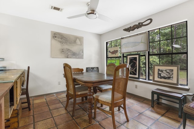 1594 Beachrock Dr, Brookeland, TX 75931 - tiled dining space with healthy amount of natural light and ceiling fan
