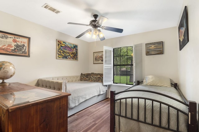 bedroom featuring ceiling fan and dark wood-type flooring