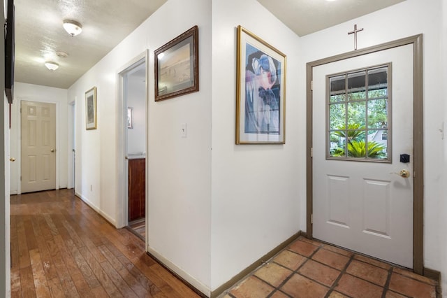 foyer with dark hardwood / wood-style flooring