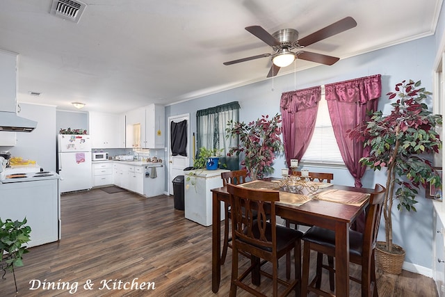 dining space with ceiling fan, ornamental molding, and dark wood-type flooring