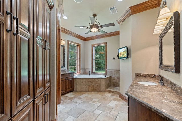 4207 S Chestnut St, Lufkin, TX 75901 - full bath with crown molding, ceiling fan, a bath, stone tile floors, and two vanities