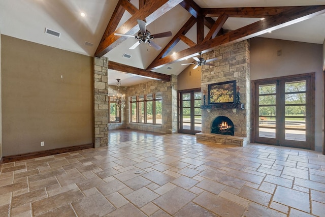 4207 S Chestnut St, Lufkin, TX 75901 - unfurnished living room with high vaulted ceiling, a fireplace, ceiling fan, stone tile floors, and plenty of natural light