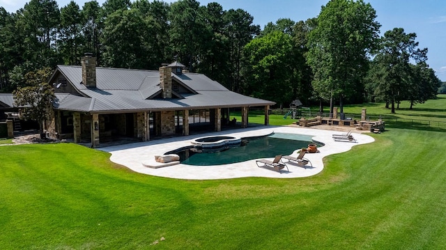 4207 S Chestnut St, Lufkin, TX 75901 - view of swimming pool featuring a patio, a pool with connected hot tub, and view of scattered trees