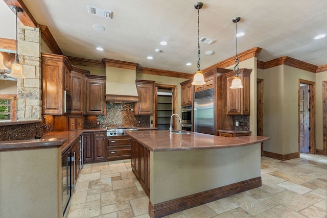 4207 S Chestnut St, Lufkin, TX 75901 - kitchen featuring appliances with stainless steel finishes, ornamental molding, premium range hood, stone tile flooring, and a sink