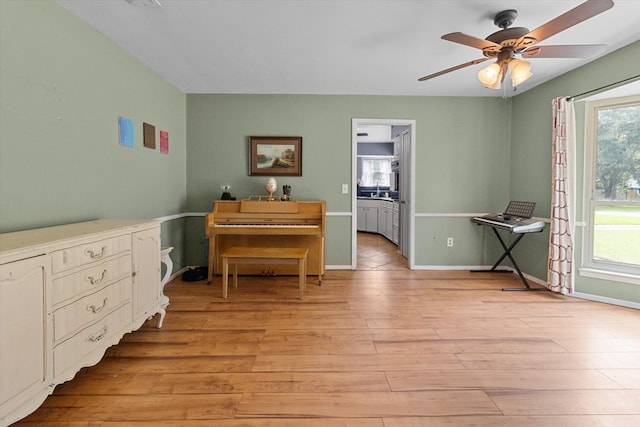 miscellaneous room featuring light hardwood / wood-style floors and ceiling fan