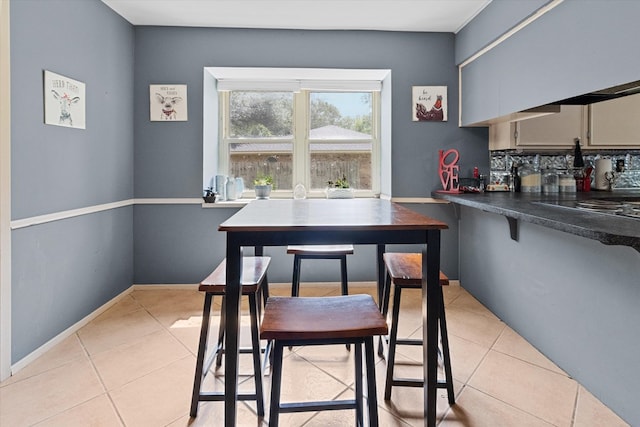 dining space with light tile patterned flooring