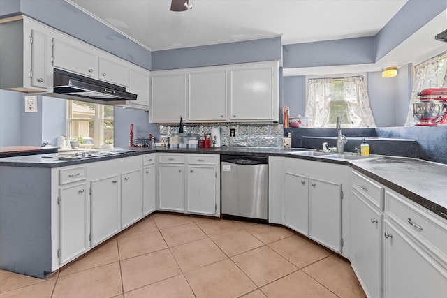 kitchen with backsplash, sink, stainless steel dishwasher, gas stovetop, and white cabinetry