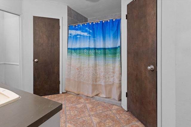 bathroom with tile patterned floors