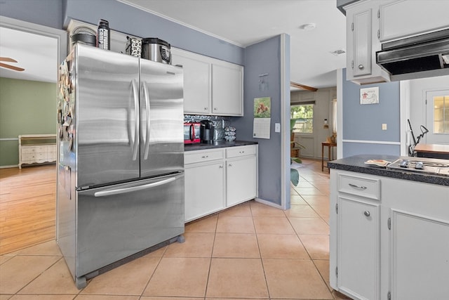 kitchen featuring light wood-type flooring, stainless steel appliances, ceiling fan, white cabinets, and range hood