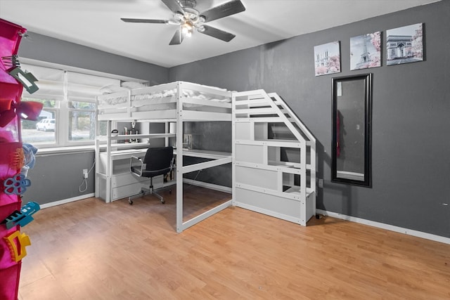 bedroom with hardwood / wood-style flooring and ceiling fan