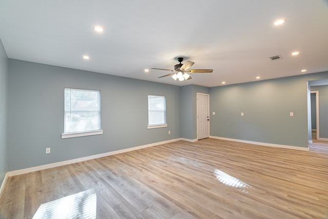 spare room with recessed lighting, baseboards, and light wood finished floors