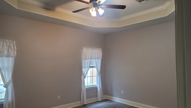 138 Breezeway Dr, Brookeland, TX 75931 - unfurnished room featuring crown molding, dark wood-type flooring, baseboards, visible vents, and ceiling fan
