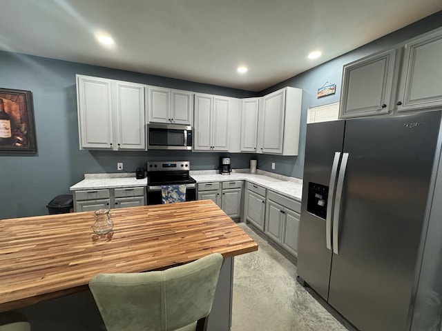 0103 Old Fm 705, Broaddus, TX 75979 - kitchen with stainless steel appliances, butcher block counters, gray cabinetry, concrete flooring, and recessed lighting