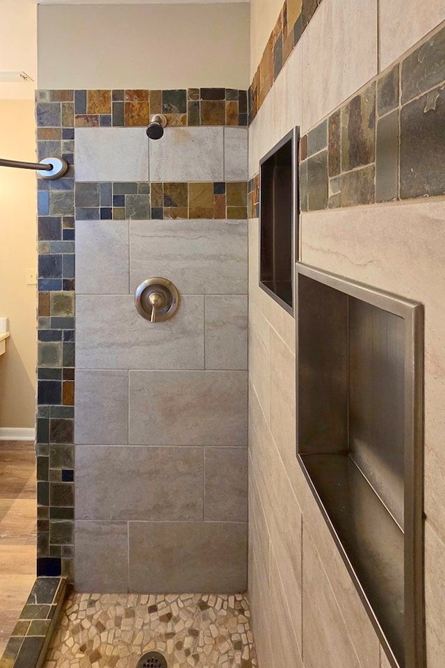 full bathroom with a tile shower