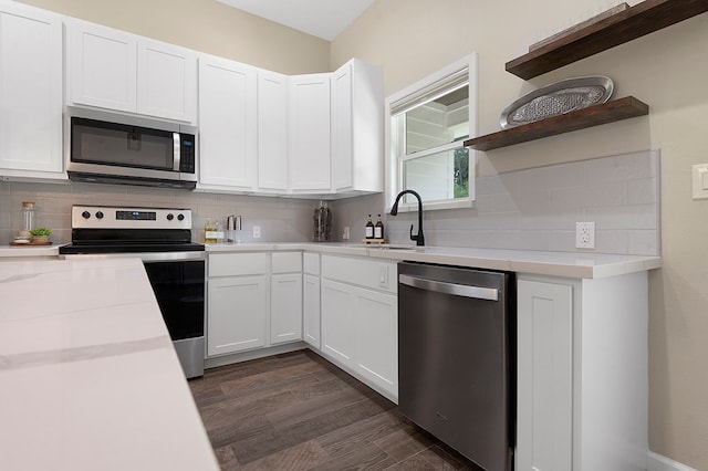 155 Sweetbriar Ct, Brookeland, TX 75931 - kitchen with appliances with stainless steel finishes, open shelves, backsplash, and light countertops