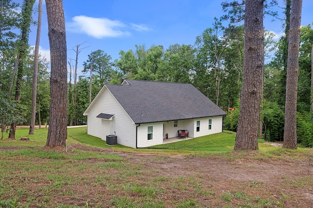 155 Sweetbriar Ct, Brookeland, TX 75931 - view of front of property with a patio area, a front lawn, and roof with shingles