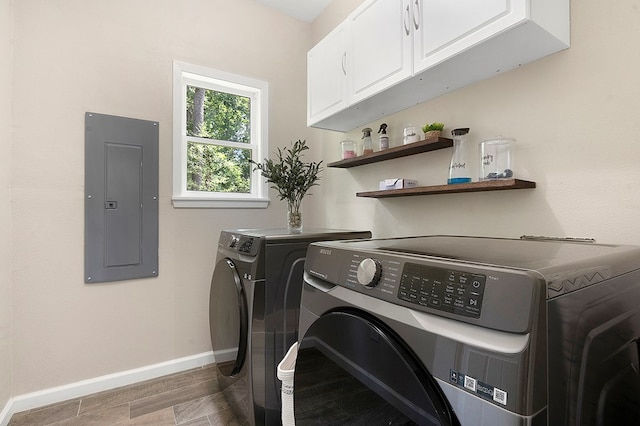 155 Sweetbriar Ct, Brookeland, TX 75931 - washroom featuring electric panel, cabinet space, and washing machine and clothes dryer