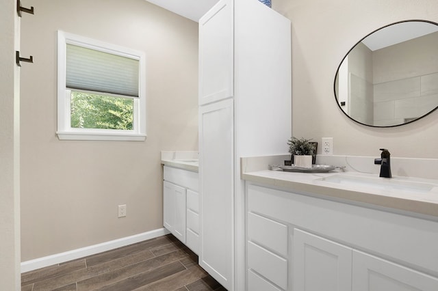 155 Sweetbriar Ct, Brookeland, TX 75931 - bathroom featuring double vanity and wood finished floors