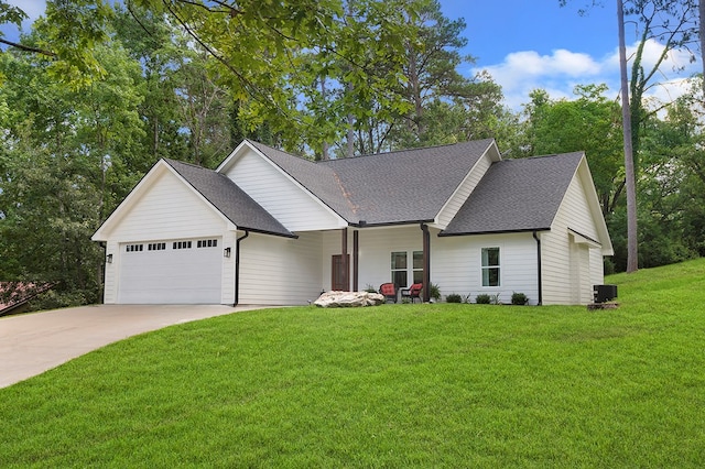 155 Sweetbriar Ct, Brookeland, TX 75931 - view of front facade featuring an attached garage, a shingled roof, a front lawn, and concrete driveway