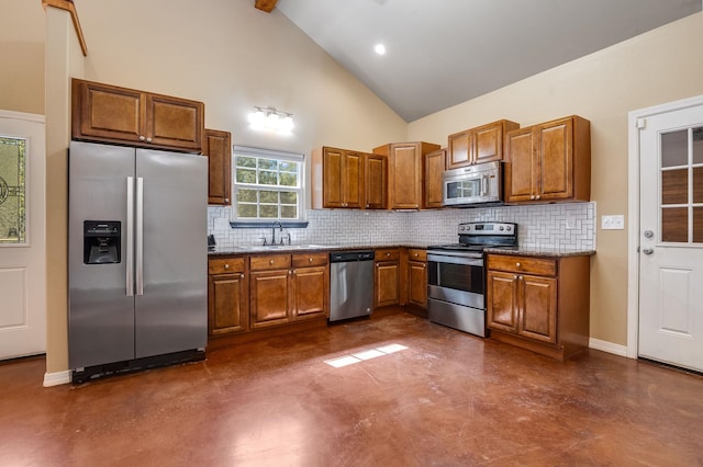 kitchen with tasteful backsplash, sink, high vaulted ceiling, and stainless steel appliances