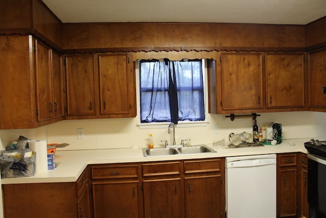 kitchen with white dishwasher, a sink, black electric range, light countertops, and brown cabinetry