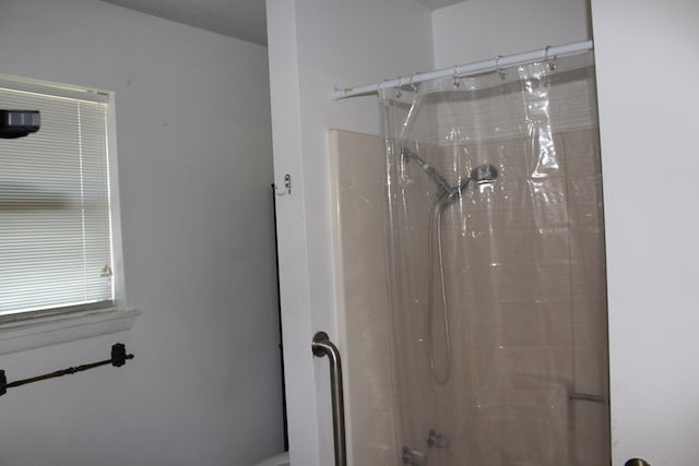 bathroom with a shower with curtain