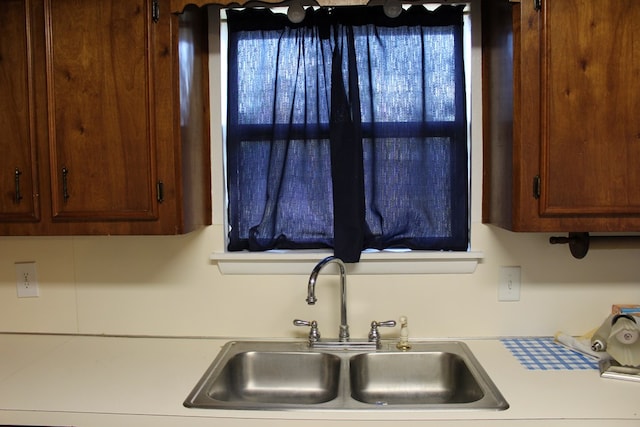 kitchen with light countertops and a sink