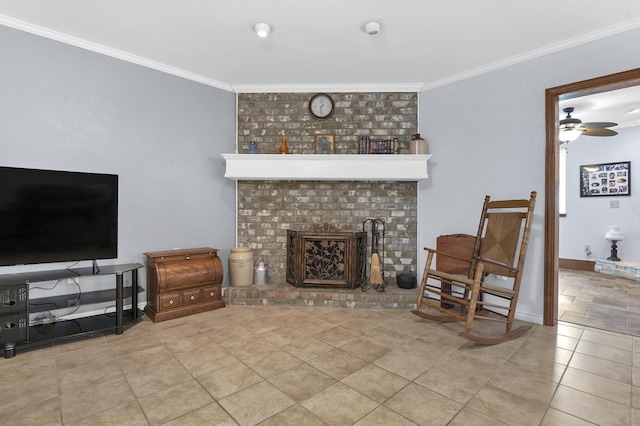 living room with a fireplace, ceiling fan, ornamental molding, and light tile patterned flooring