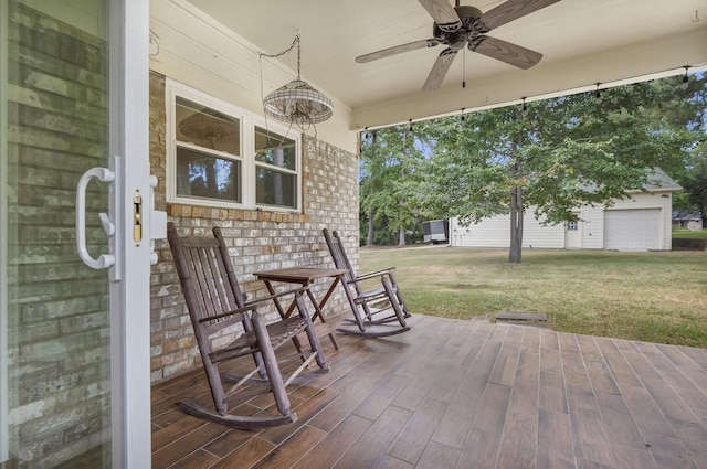 deck with ceiling fan and a yard