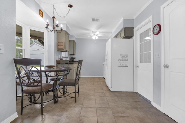 dining room featuring light tile patterned floors, ceiling fan with notable chandelier, and crown molding