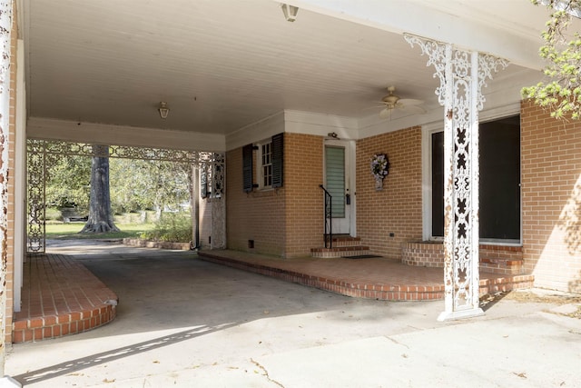 view of patio / terrace with a carport and ceiling fan