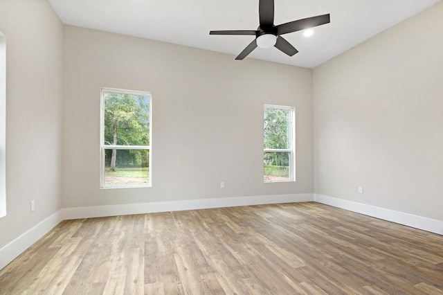 spare room with ceiling fan and light hardwood / wood-style flooring