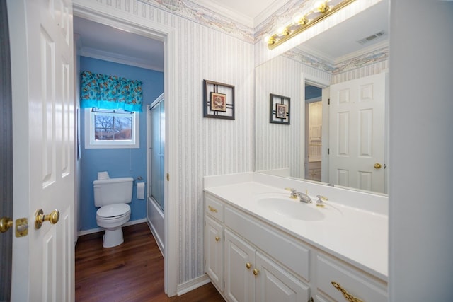 3712 Ashbury Ln, Nacogdoches, TX 75965 - full bathroom with ornamental molding, toilet, wood finished floors, wallpapered walls, and vanity