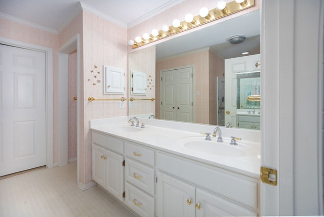 3712 Ashbury Ln, Nacogdoches, TX 75965 - bathroom featuring double vanity, ornamental molding, and wallpapered walls