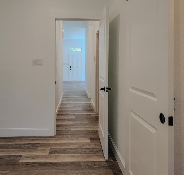 corridor featuring dark wood-type flooring