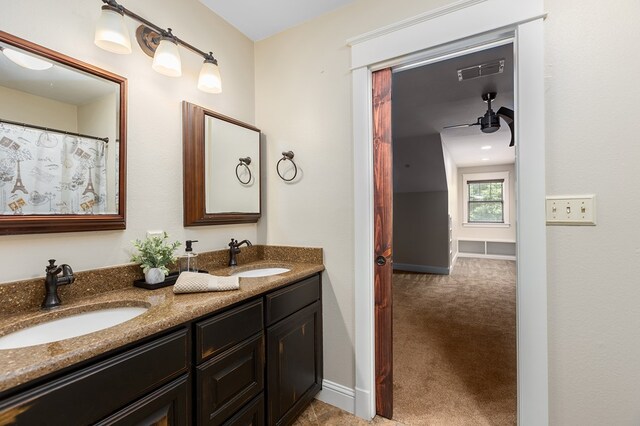 bathroom featuring ceiling fan, toilet, and vanity