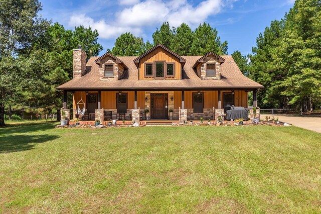 cape cod home with a front lawn and a porch