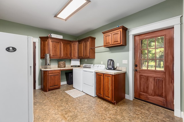 kitchen with washing machine and dryer and white refrigerator