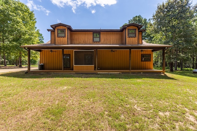 rear view of house with a yard