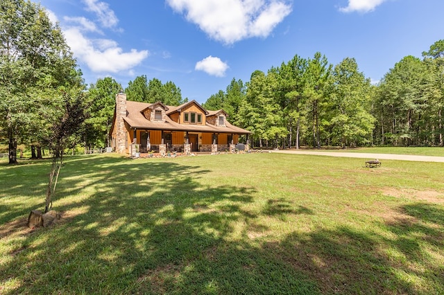 view of front of house with a porch and a front yard