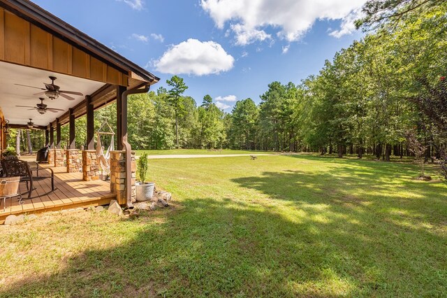 view of yard featuring ceiling fan