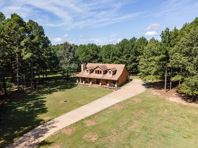 view of front facade with covered porch and a front yard