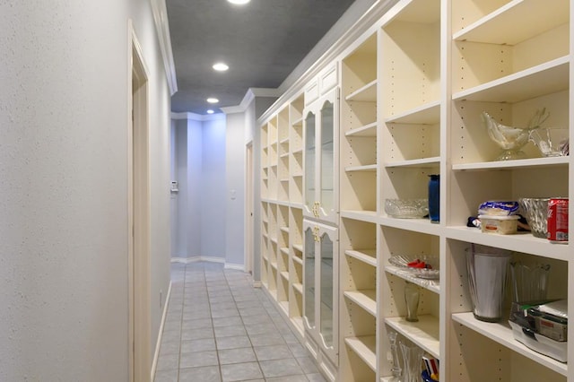 interior space featuring light tile patterned flooring, baseboards, and recessed lighting