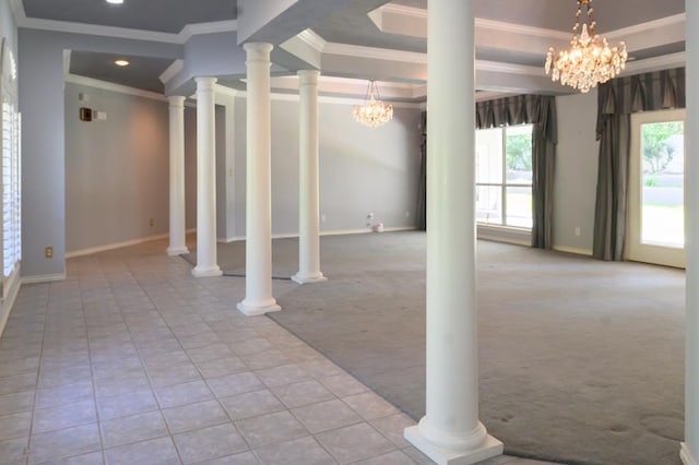 below grade area featuring baseboards, an inviting chandelier, ornamental molding, recessed lighting, and carpet